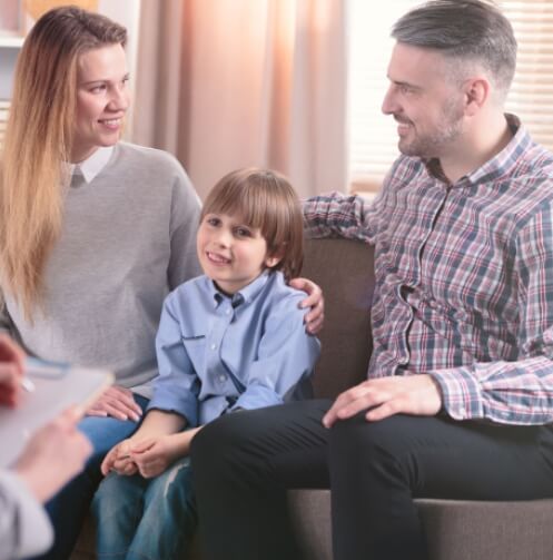 Smiling family with young boy