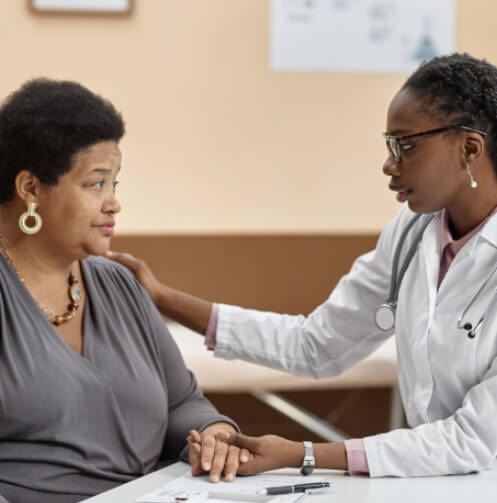 Doctor comforting a concerned patient