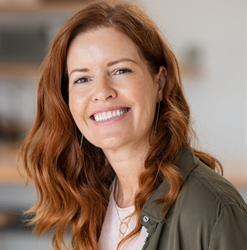 Smiling woman with red hair